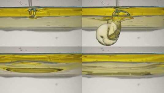 往水中倒入食用油高清在线视频素材下载
