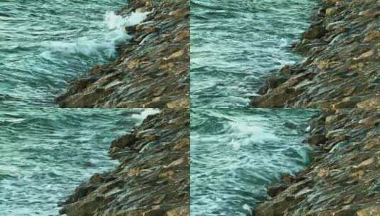 岩石表面受到海浪的冲击高清在线视频素材下载