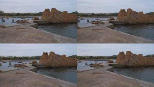 沙滩漫步视差射击周围的岩石高清在线视频素材下载