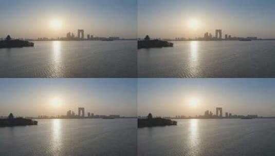日落风光苏州著名建筑东方之门与金鸡湖风光高清在线视频素材下载