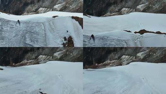 航拍攀登沙鲁里山脉尼登贡嘎雪山的登山者高清在线视频素材下载