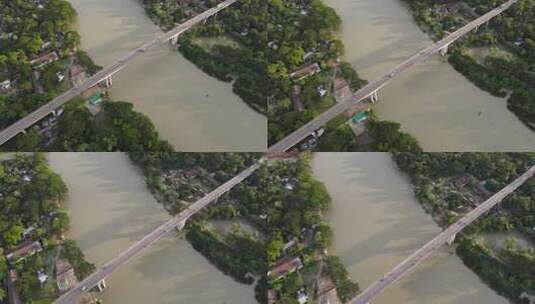 孟加拉国两个地区连接河岸村庄的桥梁鸟瞰图。无人机飞行双高清在线视频素材下载