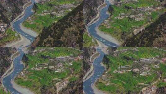 航拍山谷的村庄和河流高清在线视频素材下载