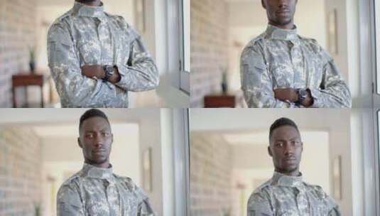 穿着军装的年轻非裔美国士兵自信地站在家里高清在线视频素材下载
