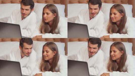 快乐的夫妇在蜜月套房对着镜头微笑高清在线视频素材下载
