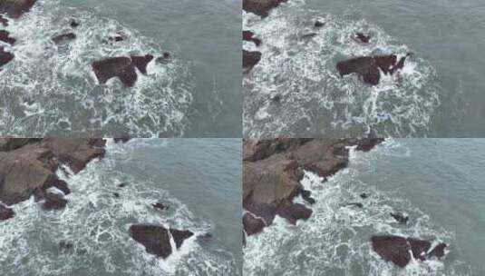 海岸礁石海水拍打礁石阴天海滩岩石海浪冲刷高清在线视频素材下载