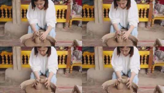 （慢镜）年轻女子在制作土陶陶瓷制作高清在线视频素材下载