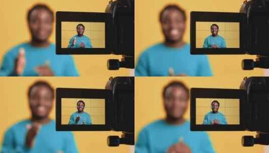 微笑的非洲人影响者拍摄视频博客Vlog相高清在线视频素材下载