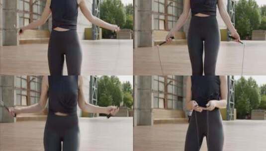 年轻女士跳绳练习高清在线视频素材下载