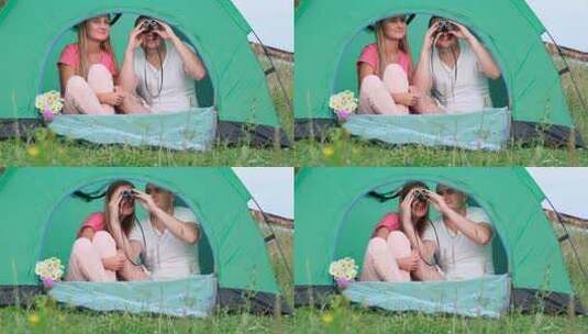 夫妇帐篷内用望远镜观看远处高清在线视频素材下载