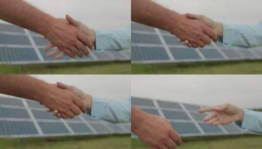 在光伏基地前两个人握手绿色能源概念高清在线视频素材下载