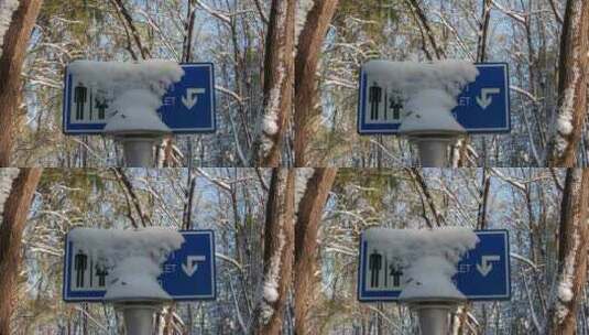 初冬雪后树木公厕卫生间指示牌覆盖冰雪高清在线视频素材下载