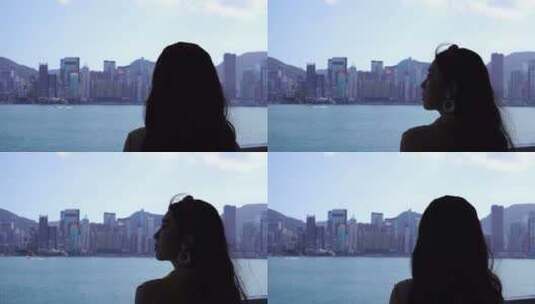 女人站在星光大道看香港岛风景维多利亚风光高清在线视频素材下载