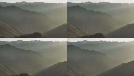 航拍清晨山脉间的日出光影高清在线视频素材下载