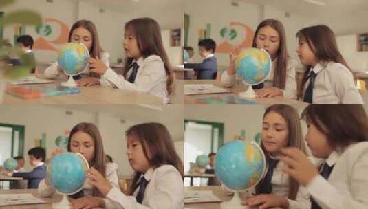 学校的孩子们看地球仪 - 小学生教育视频高清在线视频素材下载