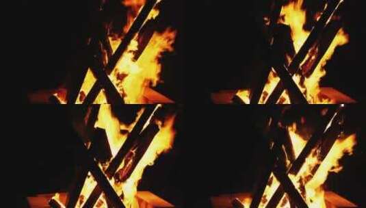 黑暗中燃烧的篝火被风吹动高清在线视频素材下载