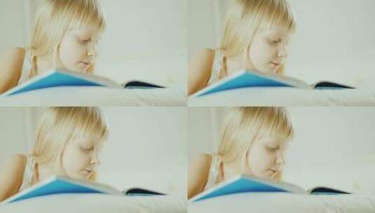 女孩在床上阅读一本书高清在线视频素材下载