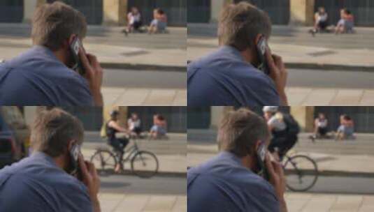 男子坐在街上打电话高清在线视频素材下载