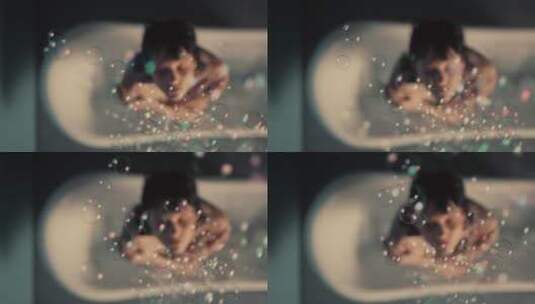 女人站在浴缸仰视彩色泡泡高清在线视频素材下载