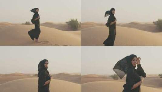 穆斯林女士在沙漠中行走高清在线视频素材下载