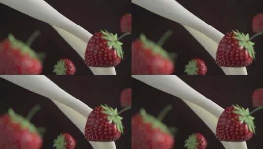 牛奶和草莓相碰撞高清在线视频素材下载
