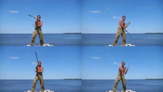 年长运动员在蓝色大海背景下展示咏春功夫成高清在线视频素材下载