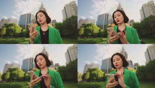 自信的中国女性在城市街道肖像上使用现代智高清在线视频素材下载