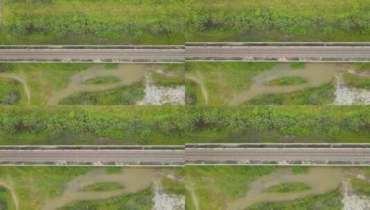 下降的航拍镜头揭示了高架铁路、绿草和棕色高清在线视频素材下载