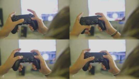 女孩在家使用黑色PS4双摇杆游戏手柄玩游戏高清在线视频素材下载