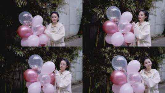 快乐的年轻女孩拿着气球高清在线视频素材下载