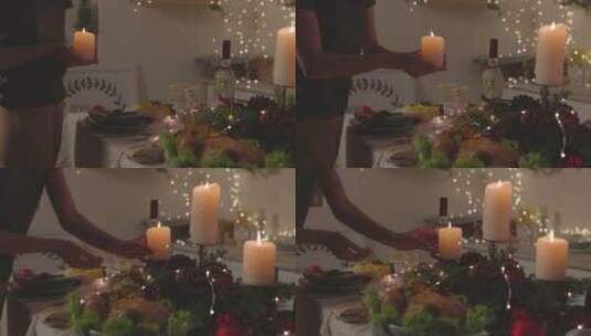女人把蜡烛放在餐桌上高清在线视频素材下载