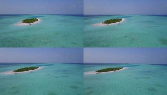 白沙天堂海滩和蓝色大海背景的日间岛屿景观高清在线视频素材下载