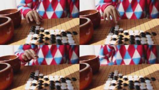 中国小孩在窗边下棋围棋高清在线视频素材下载