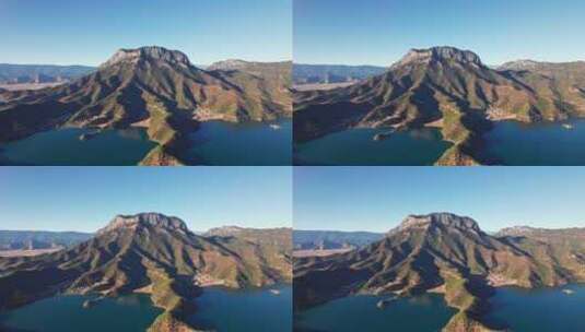 云南泸沽湖岛屿和格姆女神山日落黄昏航拍高清在线视频素材下载