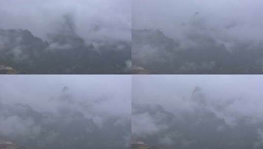 云雾缭绕的扎尕那高大山峰和寺庙云海延时高清在线视频素材下载