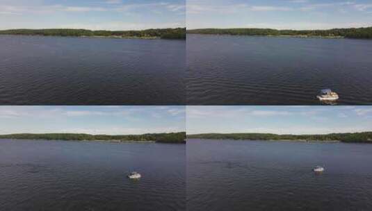 河上游艇的航拍镜头。无人机从船上拉回来。区内的海岸高清在线视频素材下载