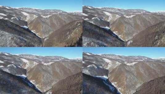 冬季山丘白雪覆盖山顶航拍高清在线视频素材下载