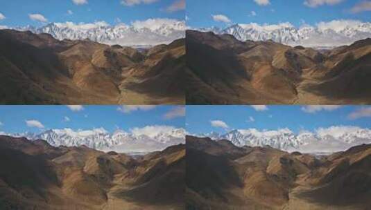 新疆荒漠与雪山同框中国地理风光景色高清在线视频素材下载
