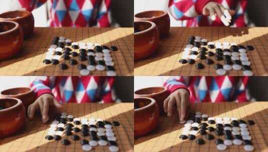 中国小孩在窗边下棋围棋高清在线视频素材下载