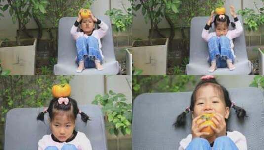 小女孩将柿子顶头上玩高清在线视频素材下载