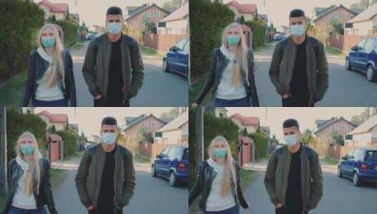 戴着医用口罩的男女走在住宅区的街道上高清在线视频素材下载