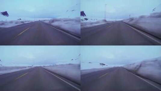 穿过冰雪覆盖的山间公路高清在线视频素材下载