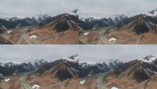雪山公路视频蜿蜒曲折雪山谷底高速公路高清在线视频素材下载