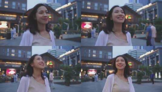 美丽中国女青年开心走在傍晚城市街头高清在线视频素材下载