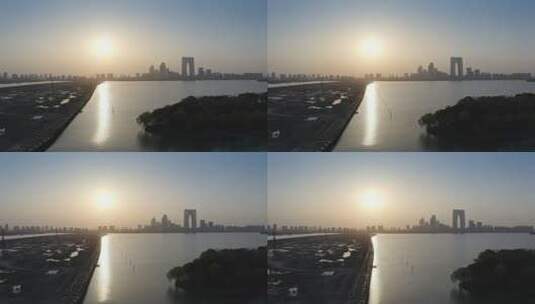 日落风光苏州著名建筑东方之门与金鸡湖风光高清在线视频素材下载