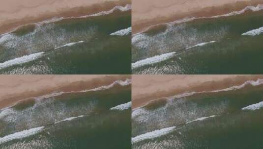 航拍海浪冲向沙滩高清在线视频素材下载