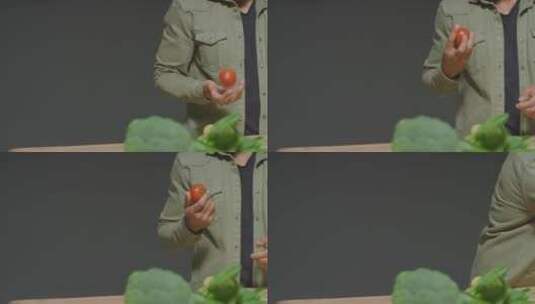 手拿西红柿的男人高清在线视频素材下载