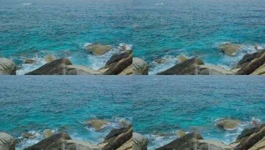 海南三亚大海边蓝色海浪拍打礁石岩石高清在线视频素材下载