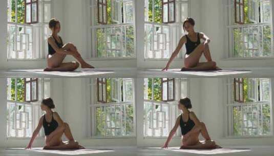 在白色大房间的垫子上练习瑜伽高清在线视频素材下载