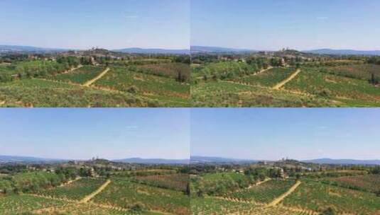 托斯卡纳乡村用无人机拍摄的葡萄酒田的夏季背景小村庄高清在线视频素材下载